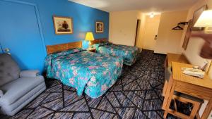 Postel nebo postele na pokoji v ubytování Guest Keeper Inn