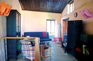 a living room with a couch and a table at Ruine-Motovun KH in Motovun