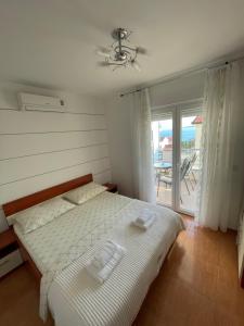 Postel nebo postele na pokoji v ubytování Villa Popic