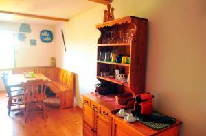 a kitchen with a wooden cabinet and a dining room at Ruine-Motovun DH in Motovun +37 photos