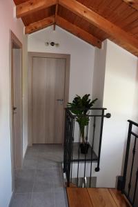 a hallway with a door and a potted plant at Villa Marta's - Marta I in Trogir