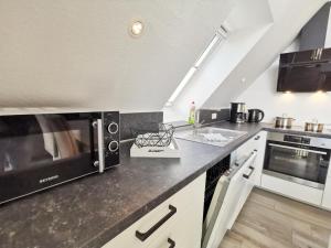 Kuchyň nebo kuchyňský kout v ubytování Ferienwohnung Langeneß