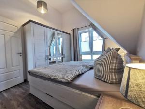 Postel nebo postele na pokoji v ubytování Ferienwohnung Langeneß