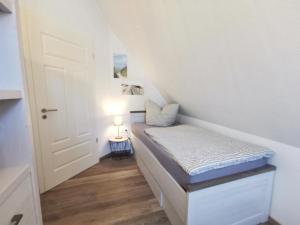 Postel nebo postele na pokoji v ubytování Ferienwohnung Langeneß