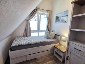 Postel nebo postele na pokoji v ubytování Ferienwohnung Langeneß