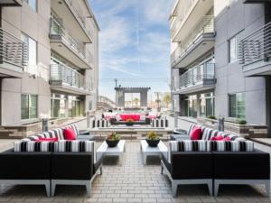 a patio with couches and tables in a building at Modern Urban Apartments│On Roosevelt Row│Local Eat & Drink in Phoenix