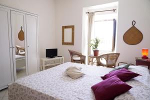 Łóżko lub łóżka w pokoju w obiekcie Casa Vacanze Irene