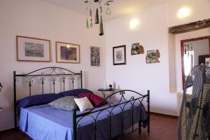 Łóżko lub łóżka w pokoju w obiekcie Casa Vacanze Irene
