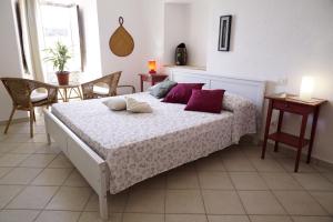 Łóżko lub łóżka w pokoju w obiekcie Casa Vacanze Irene