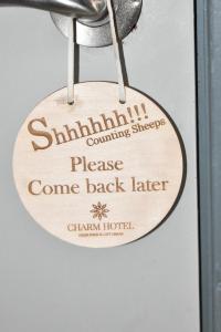 a sign that reads shillill coming sheep please come back later at Charm Hotel, Hersonissos in Hersonissos