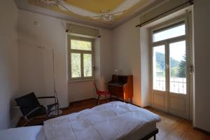 Postel nebo postele na pokoji v ubytování Villa Pineta