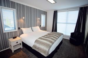 Säng eller sängar i ett rum på Luxury on Rutherford