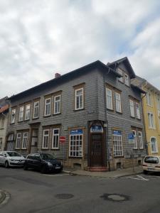 an old stone building on the corner of a street at Ferienwohnung Ohanna Goslar in Goslar