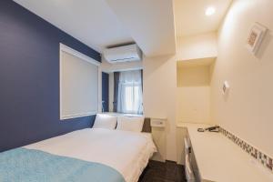 Postel nebo postele na pokoji v ubytování Asta Hotel
