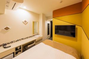 TV a/nebo společenská místnost v ubytování Asta Hotel