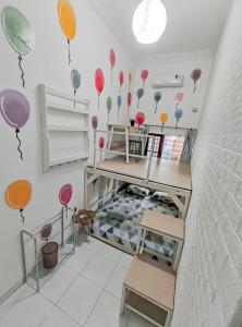 a childs room with balloons on the wall at OsteL By OstiC in Bandung