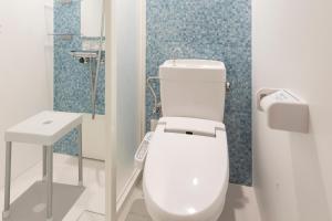 Koupelna v ubytování Asta Hotel