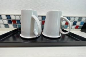 Příslušenství pro přípravu čaje a kávy v ubytování Asta Hotel