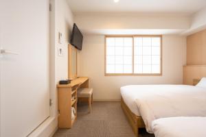 TV a/nebo společenská místnost v ubytování Fuji Hotel Kyoto Gojo
