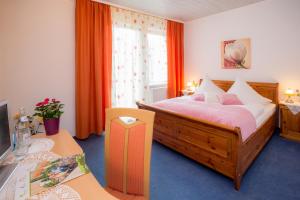 Postel nebo postele na pokoji v ubytování Hotel Restaurant Rehberg