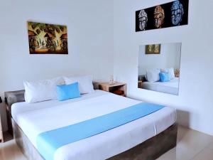 a bedroom with two beds in a room at Dream Hotel in Gili Trawangan