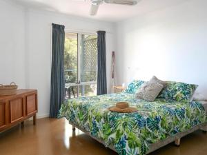 a bedroom with a bed with a hat on it at Seven on Scenic - 7 Scenic View Drive, Second Valley in Second Valley