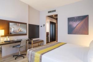 Postel nebo postele na pokoji v ubytování Savhotel Fiera Bologna