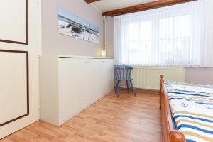 Postel nebo postele na pokoji v ubytování Ferienwohnung Deichtor im Haus am Deichtor + 7 fotografií