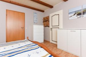 Postel nebo postele na pokoji v ubytování Ferienwohnung Deichtor im Haus am Deichtor