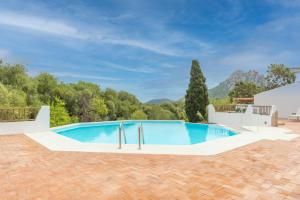 a swimming pool in a villa with a view at Cozy apartment Lemon San Pantaleo in Olbia