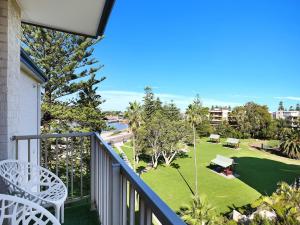 a balcony with a view of a park at Boat Harbour Motel in Wollongong