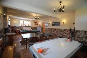 a ping pong room with two ping pong tables at DW U Wajdy in Białka Tatrzańska
