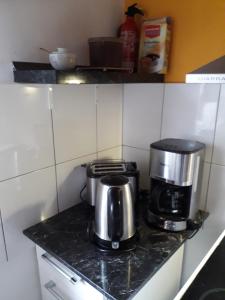 Kuchyň nebo kuchyňský kout v ubytování Heidehaus Hodenhagen