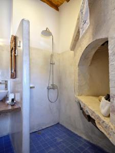 a bathroom with a shower and a sink at Kambos House in Kimolos