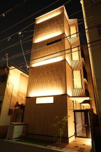 a building with lights on the side of it at Koti Sopo Universal Bay 3 by Liaison in Osaka
