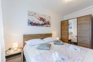 Postel nebo postele na pokoji v ubytování Apartman Mare