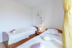 Postel nebo postele na pokoji v ubytování Apartman Mare