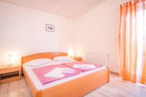 Postel nebo postele na pokoji v ubytování Apartmants Bogdanic Krk II