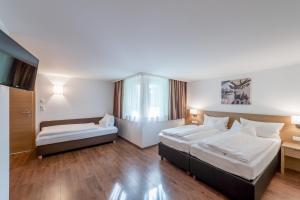 Postel nebo postele na pokoji v ubytování Apart Hotel Garni Wieser