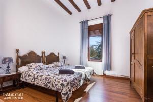 En eller flere senge i et værelse på L'Amagatall de Cal Tonedor