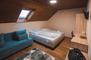 Postel nebo postele na pokoji v ubytování Natúra Panzió&Apartmanház