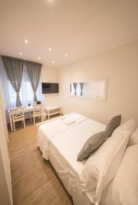 A bed or beds in a room at BePlace Aventino