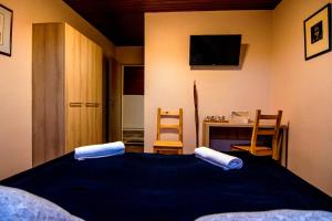 Postel nebo postele na pokoji v ubytování Natúra Panzió&Apartmanház