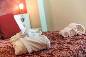 Postel nebo postele na pokoji v ubytování Hotel Royal-Spiaggia