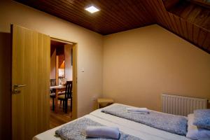 Postel nebo postele na pokoji v ubytování Natúra Panzió&Apartmanház