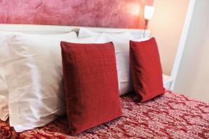 Postel nebo postele na pokoji v ubytování Hotel Royal-Spiaggia