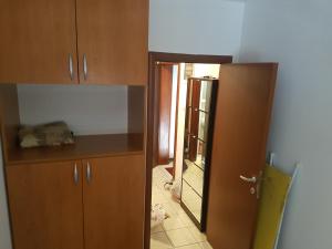 an open door to a kitchen with a mirror at Katarina Apartment Kotor in Dobrota