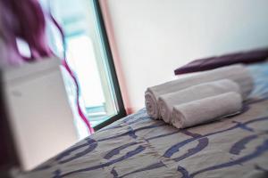 Postel nebo postele na pokoji v ubytování Hotel Royal-Spiaggia