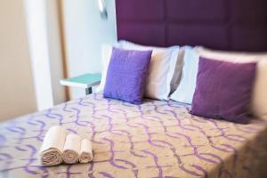 Postel nebo postele na pokoji v ubytování Hotel Royal-Spiaggia