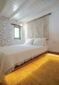 Voodi või voodid majutusasutuse Levantes Ios Boutique Hotel toas